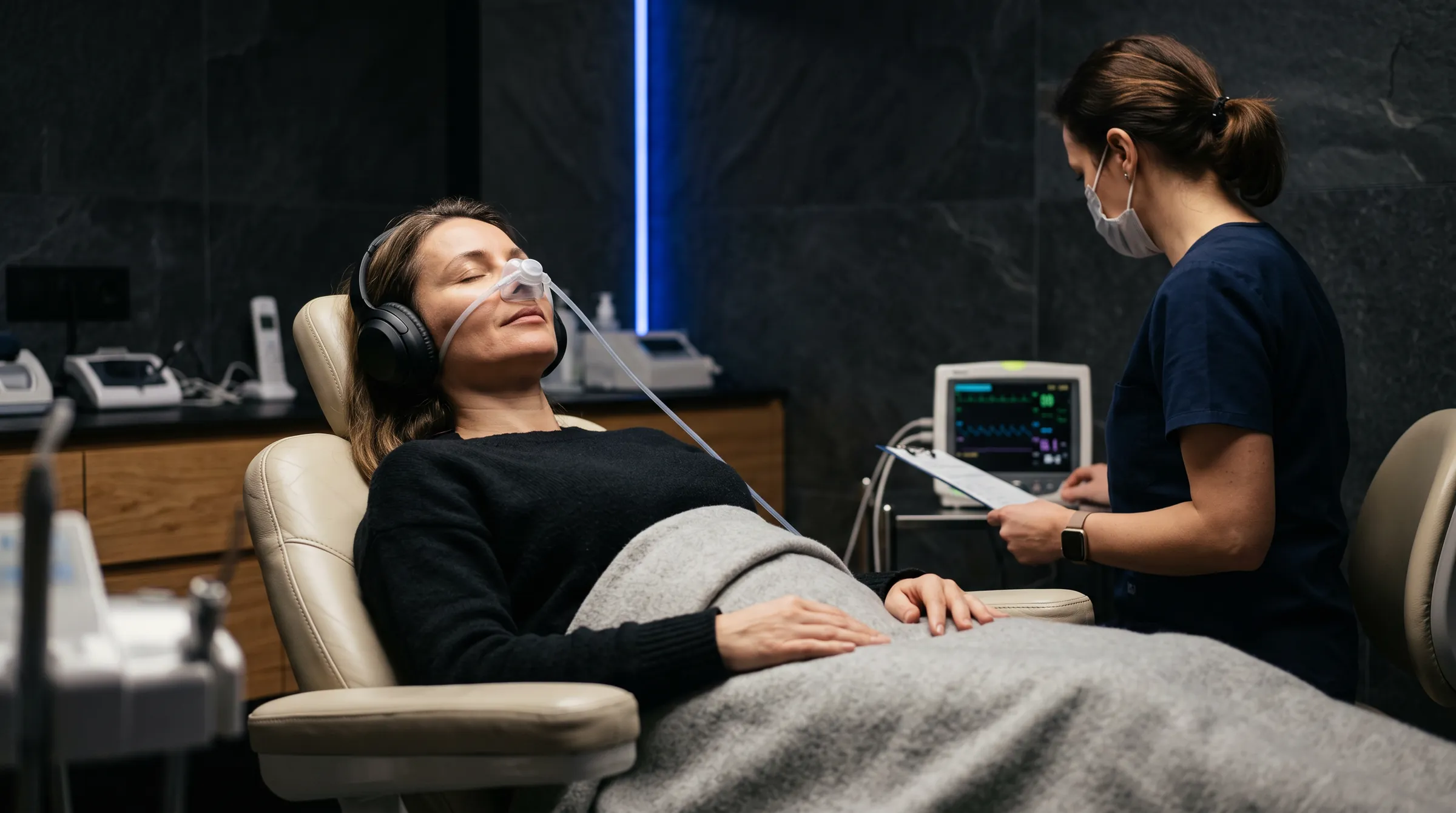 A relaxed patient with closed eyes under nitrous oxide sedation